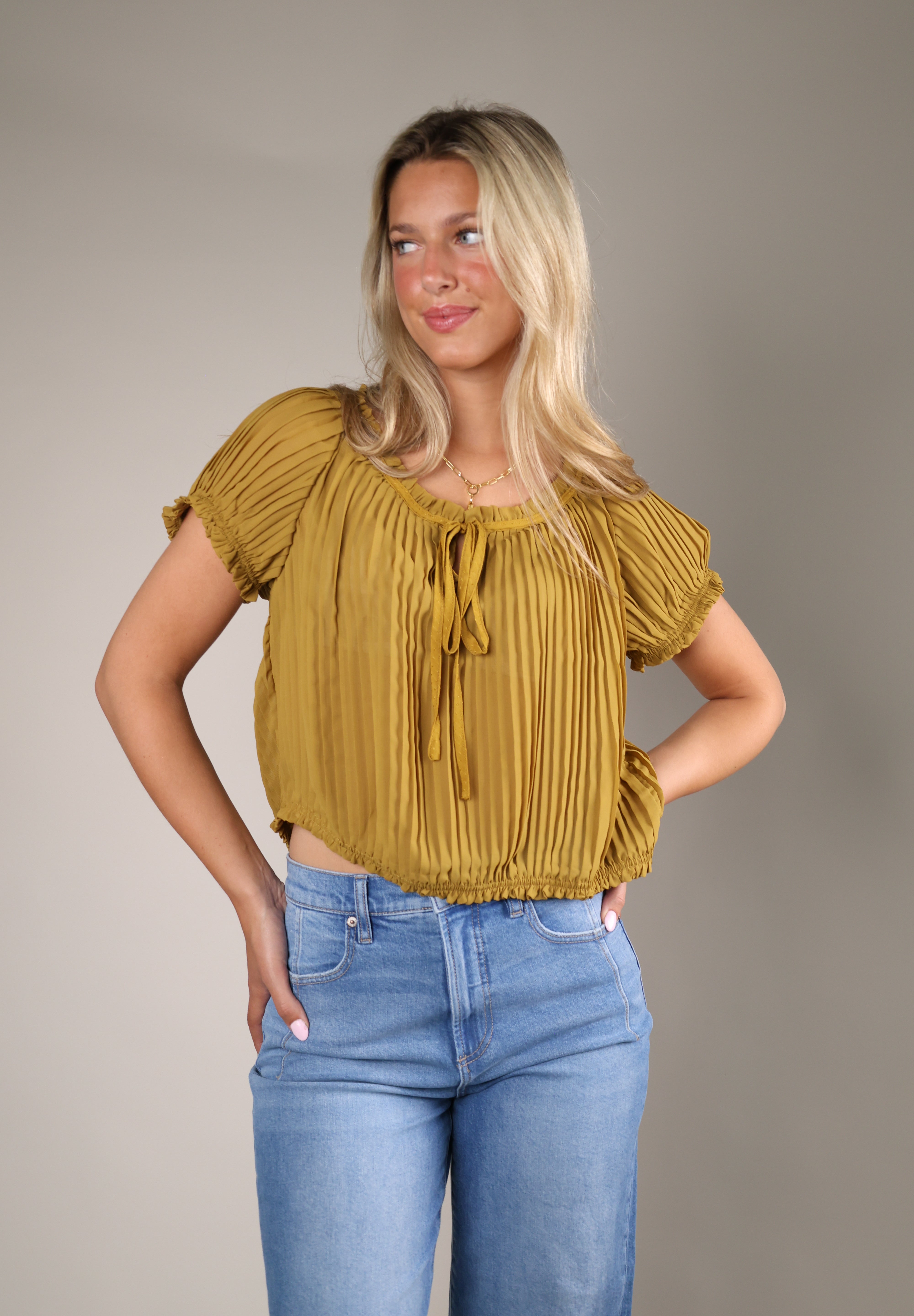 Theodora Top in yellow featuring pleated chiffon fabric, puff sleeves, and feminine ruffle details from Shear Boutique
