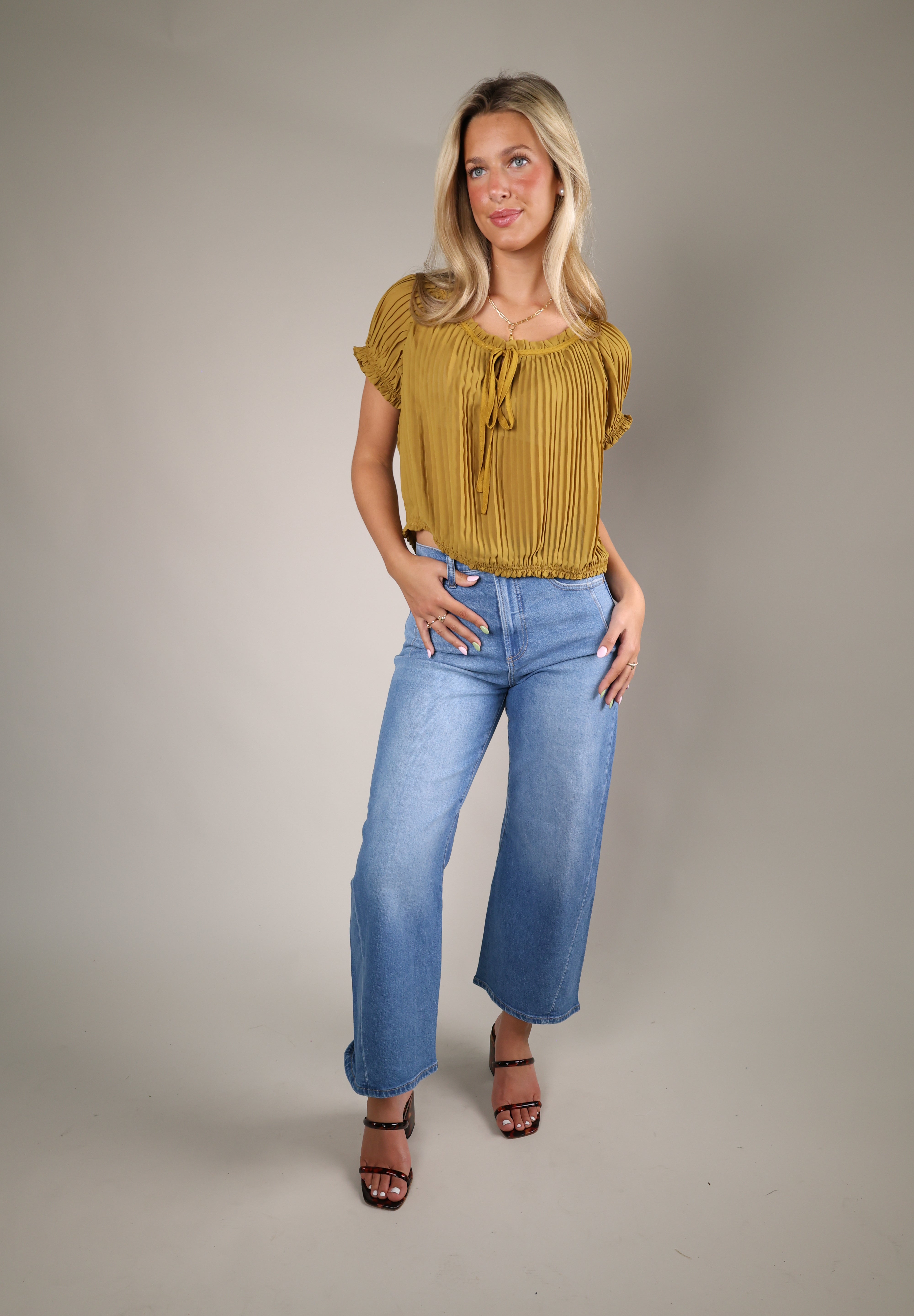 Theodora Top, a romantic women’s summer blouse with airy fabric, soft puff sleeves, and timeless everyday elegance from Shear Boutique