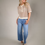 Relaxed-fit striped crochet sweater in Taro featuring an airy open-knit design, button-front Henley neckline, and soft summer-ready fabric.