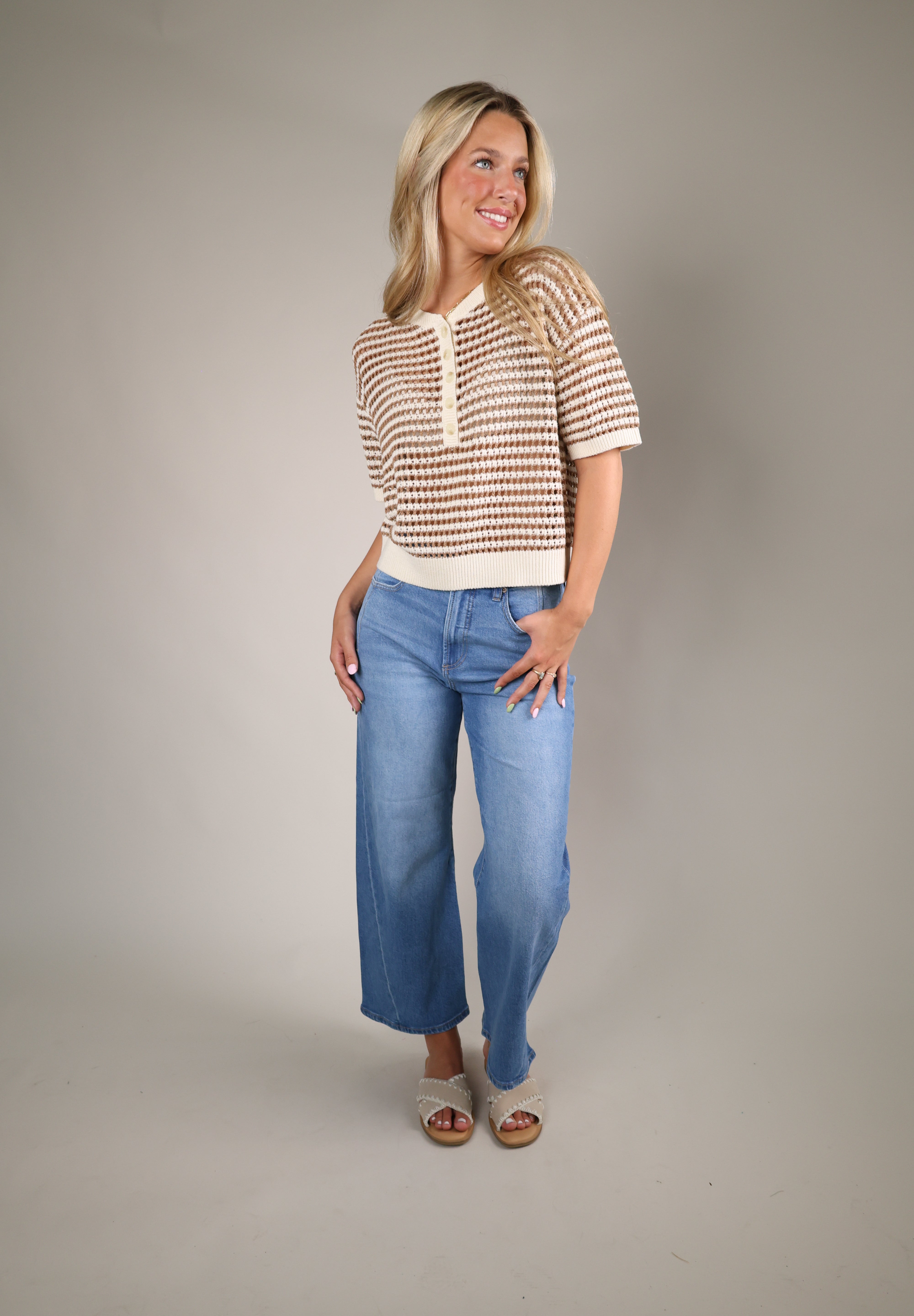 Relaxed-fit striped crochet sweater in Taro featuring an airy open-knit design, button-front Henley neckline, and soft summer-ready fabric.