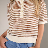 Lightweight striped sweater with a boxy silhouette and open-knit crochet texture, styled for effortless beach vacations and casual summer days.