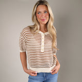 Woman wearing the Kylo Striped Sweater in Taro, a lightweight open-knit crochet sweater with short sleeves, striped design, and Henley button neckline.