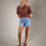 Women’s cropped knit sweater with relaxed elbow-length sleeves, classic crew neckline, and rich sorrell colorway