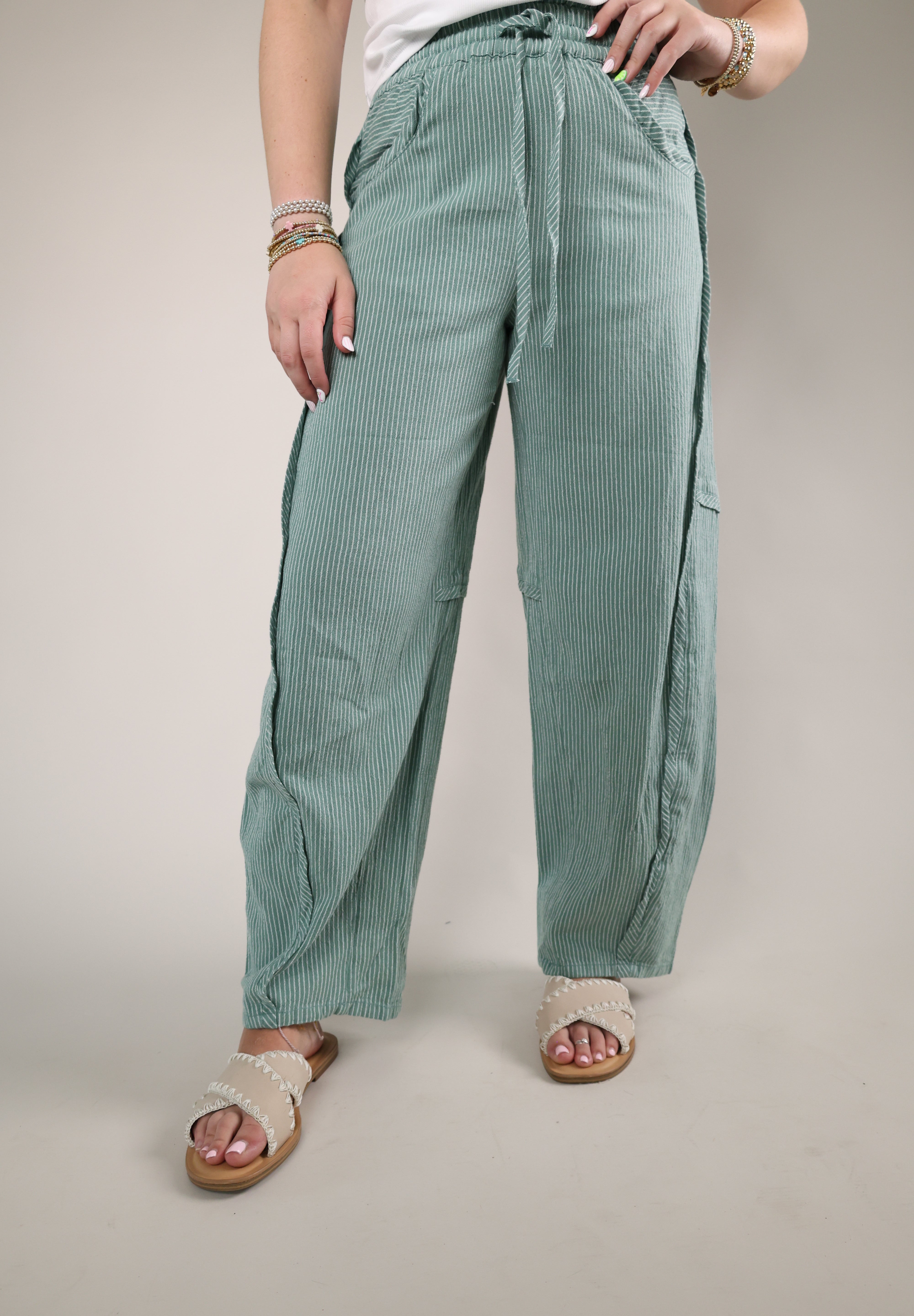 Blue stripe cotton pants with barrel leg silhouette and drawstring waist relaxed fit