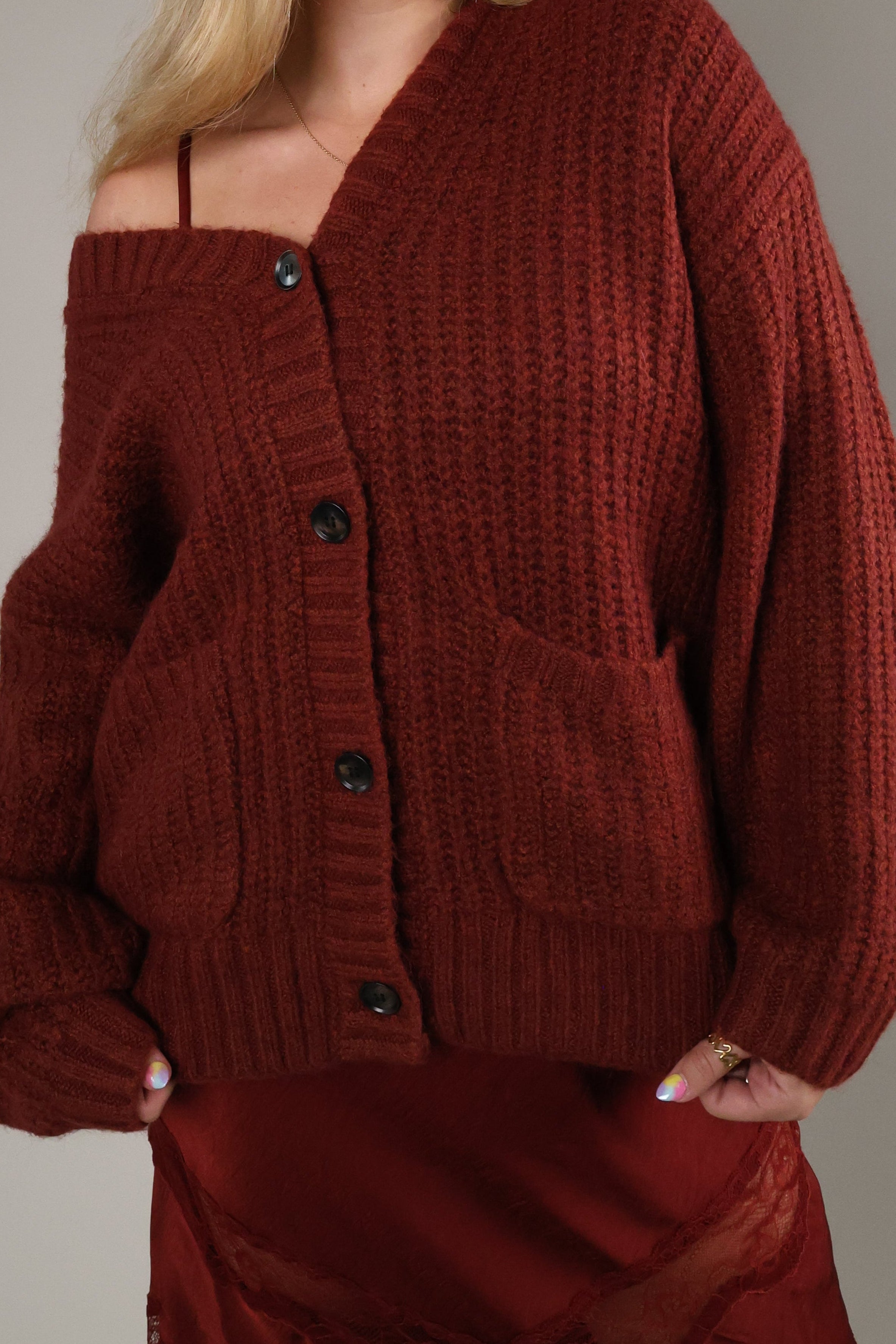 Women’s Velvet Rouge oversized cardigan with V-neckline, tortoise buttons, and front patch pockets