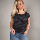 Reversible polka dot seamless top styled with denim for an effortless everyday outfit