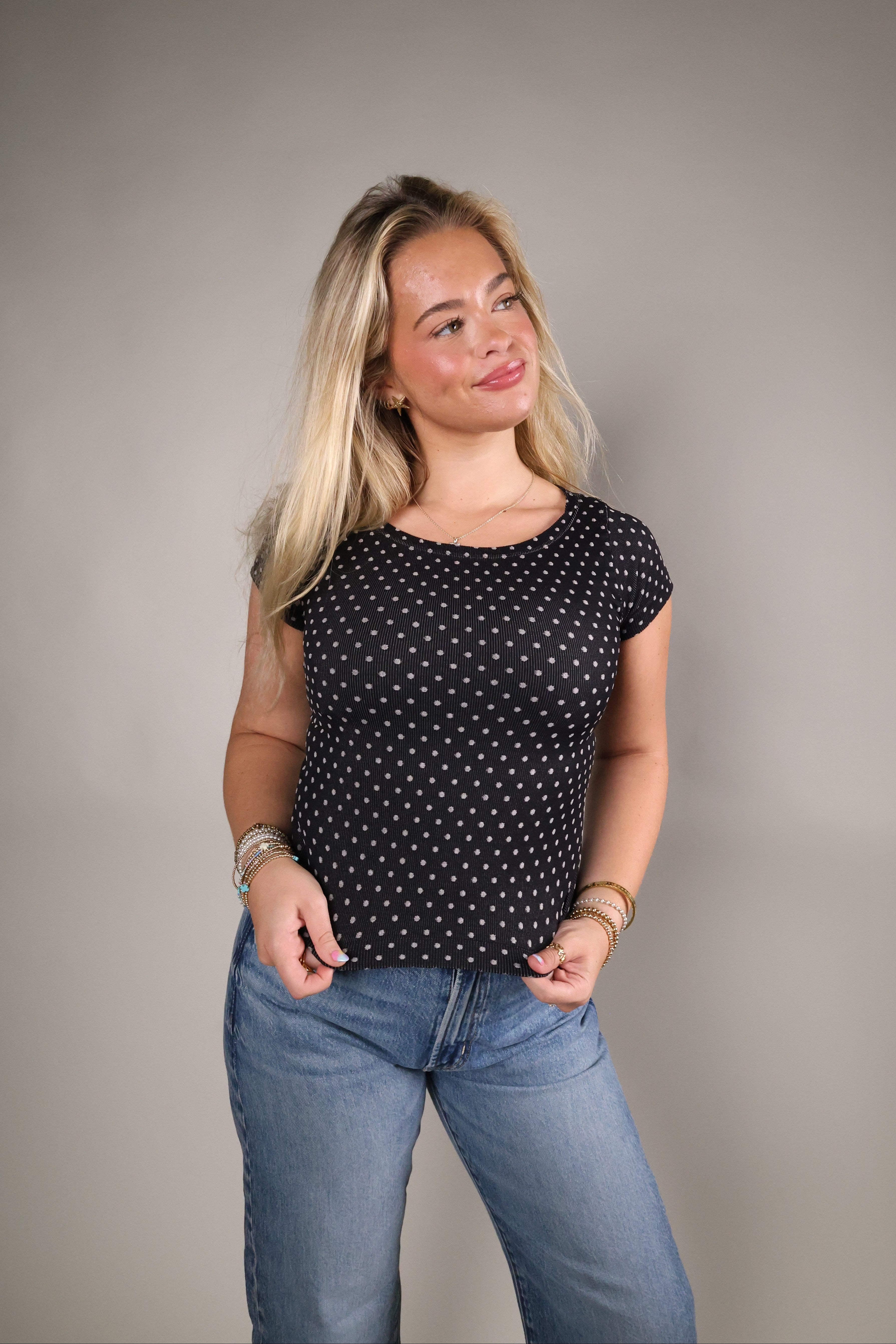Reversible polka dot seamless top styled with denim for an effortless everyday outfit