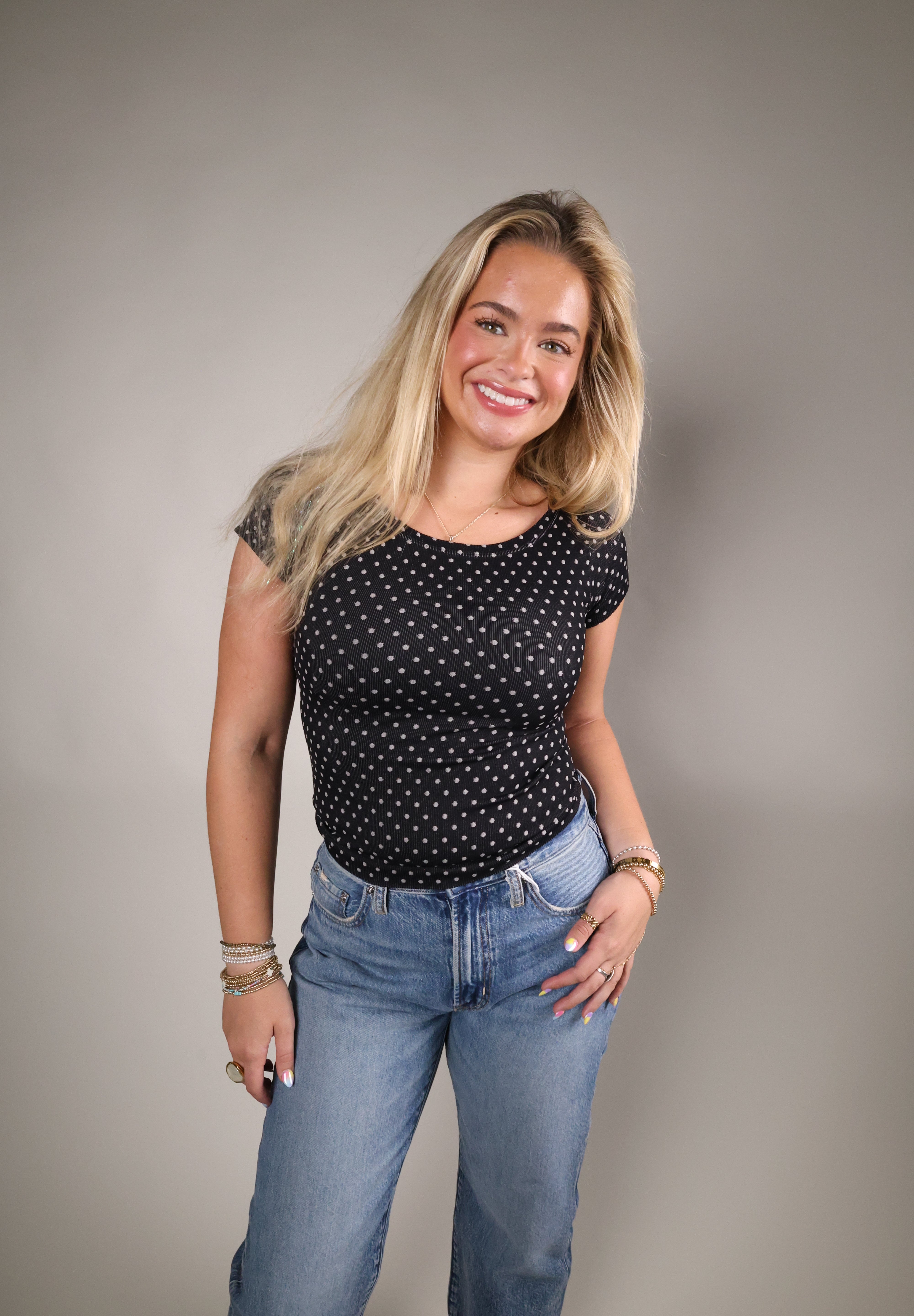 Women’s polka dot cap sleeve top with soft stretchy fabric and reversible design