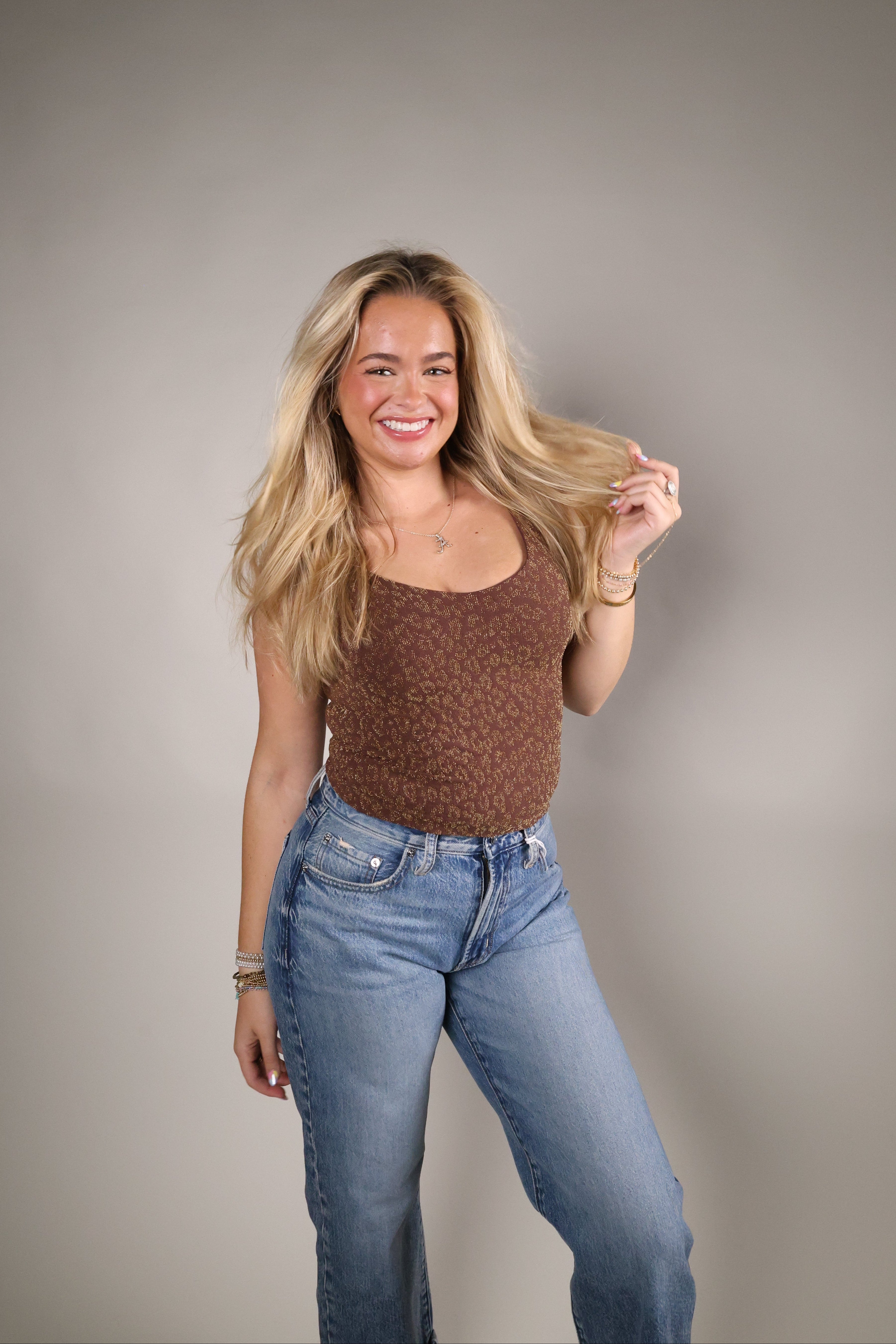 Women’s one-size seamless tube top with textured lace fabric and subtle metallic Lurex detail