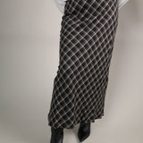Europa Plaid Maxi Skirt in ash black with a high-rise fit, flowy silhouette, and classic fall plaid print.