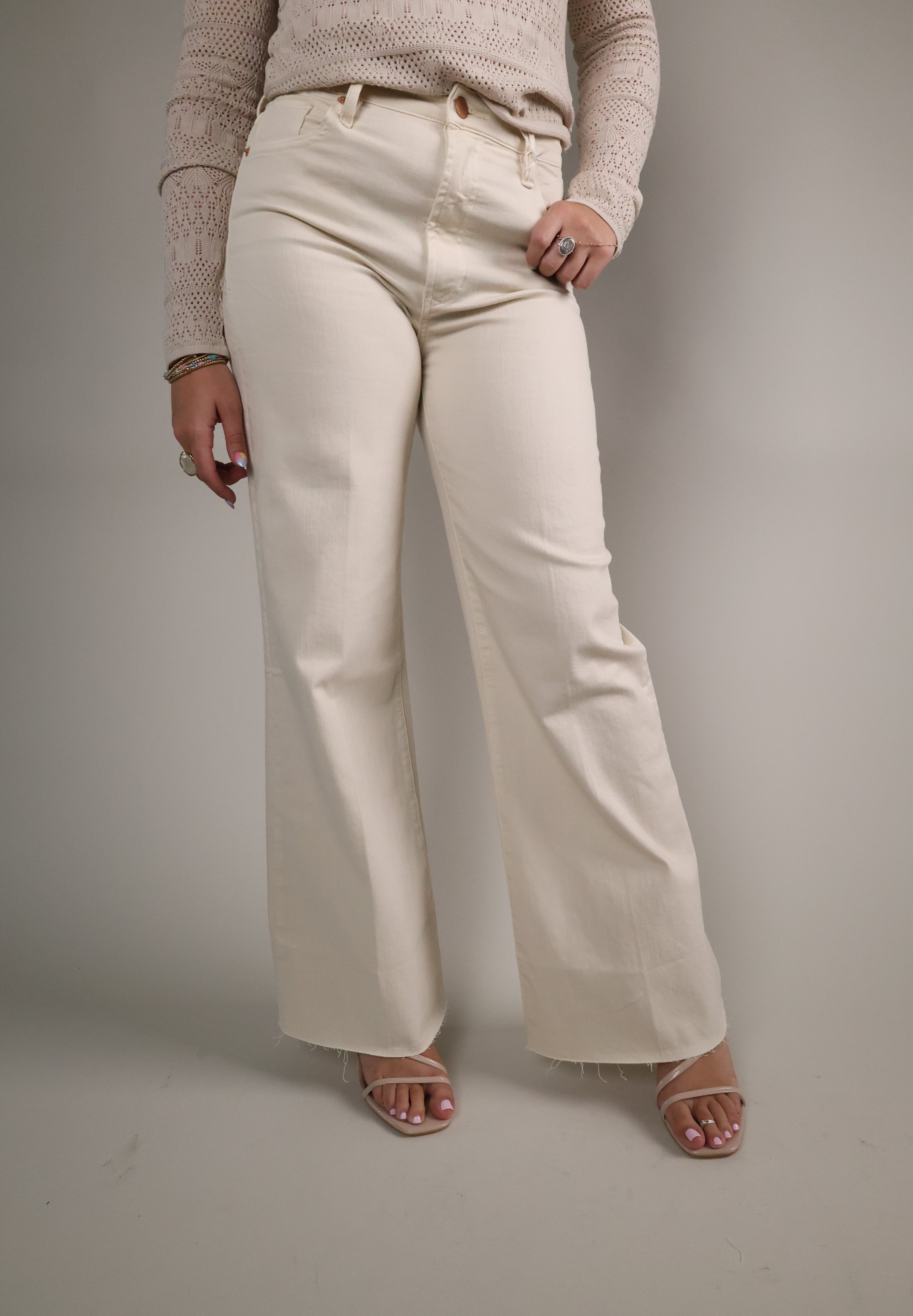 Women’s Wheat wide-leg jeans with high-rise fit, soft stretch denim, and raw hem