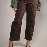 Trendy women’s barrel jeans in brown leopard print, styled as a statement denim look for fall.